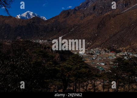 Namchebazaar, Khumjung Valley and Himalayas of Everest Base Camp Trekking in Solukhumbu, Nepal with Buddhist Prayer Flags and Wheel Stock Photo