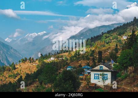 Namchebazaar, Khumjung Valley and Himalayas of Everest Base Camp Trekking in Solukhumbu, Nepal with Buddhist Prayer Flags and Wheel Stock Photo