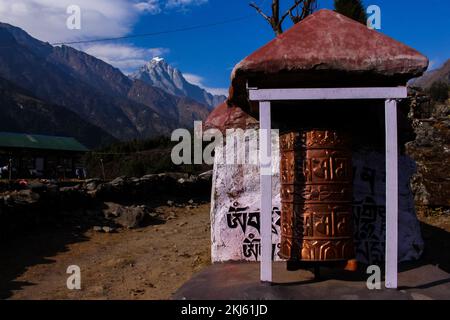 Namchebazaar, Khumjung Valley and Himalayas of Everest Base Camp Trekking in Solukhumbu, Nepal with Buddhist Prayer Flags and Wheel Stock Photo