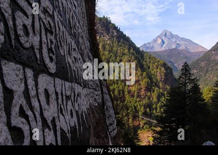 Namchebazaar, Khumjung Valley and Himalayas of Everest Base Camp Trekking in Solukhumbu, Nepal with Buddhist Prayer Flags and Wheel Stock Photo