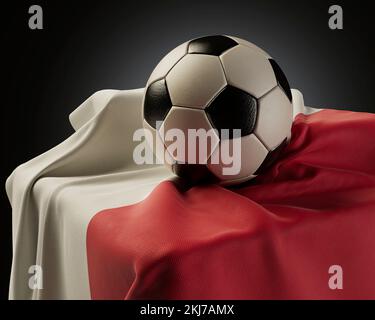 A regular soccer balls resting on a Poland flag draped over a plinth on an isolated studio background - 3D render Stock Photo