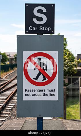 Warning sign: Passengers Must Not Cross the Line Stock Photo