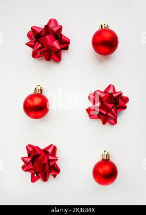 Golden Christmas baubles decoration on bright background. Flat lay. Holiday concept. Stock Photo