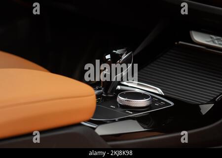 Modern automatic gearbox. Close up of the gearbox transmission handle. Automatic gear stick. Stock Photo