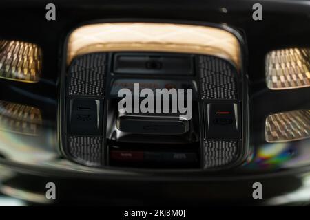 Close up image of the SOS button and car ceiling lamp in a car. Stock Photo