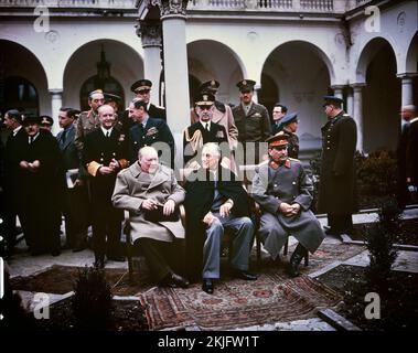 The big three at the Yalta Conference during WW2.  Front row Winston Churchill, Franklin D. Roosevelt and Joseph Stalin. Also present are Soviet Foreign Minister Vyacheslav Molotov (far left); Field Marshal Sir Alan Brooke, Admiral of the Fleet Sir Andrew Cunningham, RN, Marshal of the RAF Sir Charles Portal, RAF, (standing behind Churchill); General George C. Marshall, Chief of Staff of the United States Army, and Fleet Admiral William D. Leahy, USN, (standing behind Roosevelt) Stock Photo