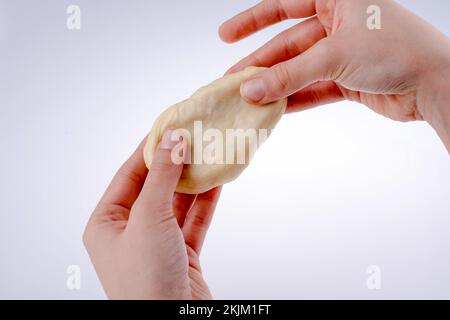 Hand holding paste on a white background Stock Photo - Alamy