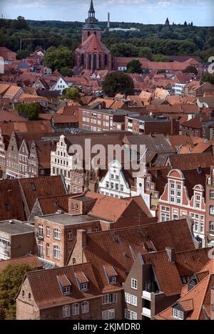 Historic gabled houses in the old town, Michaelis Church in the back, Lüneburg, Lower Saxony, Germany, Europe Stock Photo