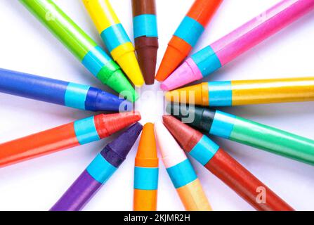 Rays of color wax crayons in a pattern Stock Photo