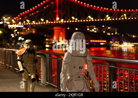 People in Storm trooper costume walking along Brisbane river walk Stock Photo