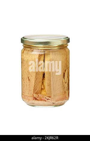 Preserved tuna fish fillets in a glass jar. Isolated on white background with clipping path Stock Photo