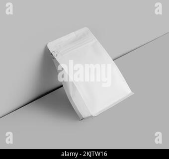 Template of a white doy pack for tea, zip packing diagonally, clouded on the wall, isolated on the background. Mockup of an empty package of coffee be Stock Photo