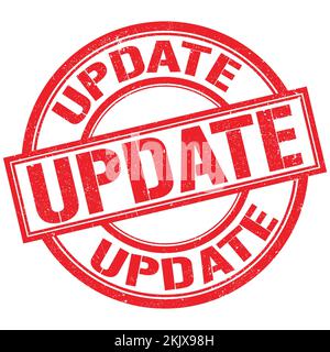 UPDATE text written on red lines stamp sign Stock Photo - Alamy