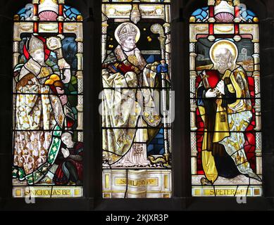 St Hilary's Church, Wallasey UK - Three Saints Stained Glass Window Stock Photo