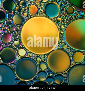 multicolored oil circles on the water, abstract background Stock Photo