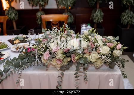 a wedding table with food and decor in the restaurant Stock Photo
