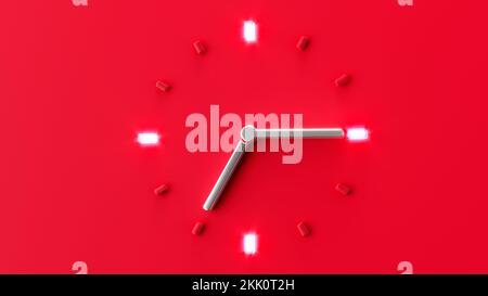 A red clock silver needle isolated on a red background Stock Photo