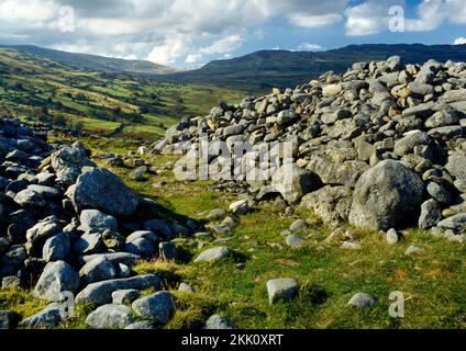 View looking NW out through the W entrance passage of the inner rampart (there are up to three) of Pen y Gaer Iron Age hillfort, Conwy, Wales, UK. Stock Photo