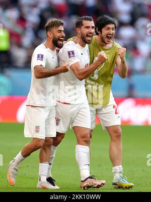 Iran's Vahid Amiri (left) and Karim Ansarifard (centre) and Sardar Azmoun celebrate after the FIFA World Cup Group B match at the Ahmad Bin Ali Stadium, Al-Rayyan. Picture date: Friday November 25, 2022. Stock Photo