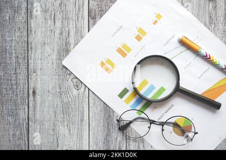 financial graph, calculator and notepad on table  Stock Photo