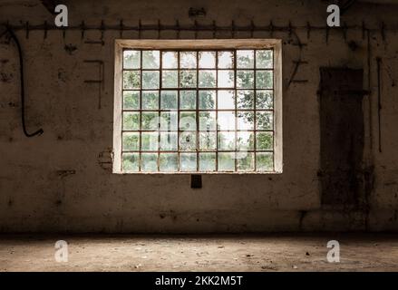 Gridded wide window on the old vintage wall. Grunge image technique concept image. Stock Photo