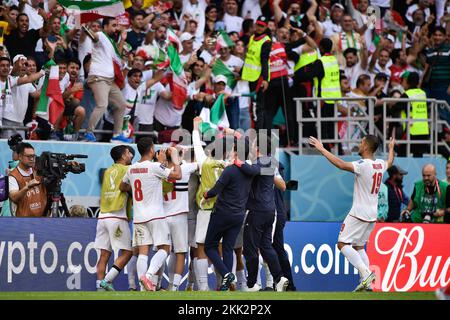 Doha, Qatar. 25th Nov, 2022. DOHA, QATAR - NOVEMBER 25: Roozbeh Cheshmi of IR Iran celebrates after scoring his sides first goal with Hossein Hosseini of IR Iran, Milad Mohammadi of IR Iran, Morteza Pouraliganji of IR Iran, Majid Hosseini of IR Iran, Ramin Rezaeian of IR Iran, Ehsan Haji Safi of IR Iran, Saeid Ezatolahi of IR Iran, Ahmad Noorollahi of IR Iran, Mehdi Taremi of IR Iran, Ali Gholizadeh of IR Iran, Sardar Azmoun of IR Iran, Payam Niazmand of IR Iran, Amir Abedzadeh of IR Iran, Sadegh Moharrami of IR Iran, Shojae Khalilzadeh of IR Iran, Alireza Jahanbakhsh of IR Iran, Karim Ansarif Stock Photo