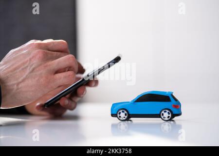 Buy And Sell Car Insurance Online On Phone Stock Photo