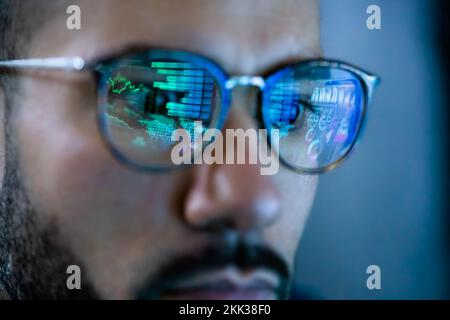 Information Business Technology Professional Working At Night. Wearing Glasses Stock Photo