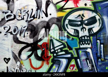 A Berlin 2019 spray painted tag line with a skull on the right portion of the image Stock Photo