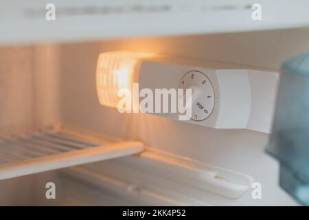 Save electricity by lowering refrigerator power - cooling mode Stock Photo