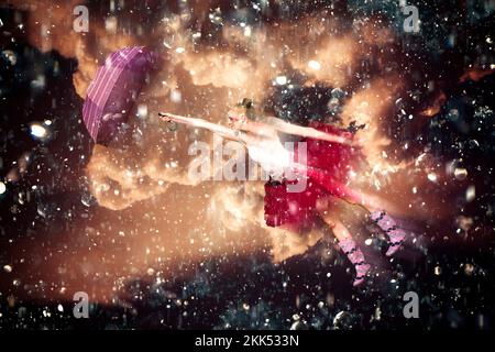 Unique Artwork Of A Ballerina Wearing Tutu And Holding Umbrella Flying Around In The Pouring Rain And Thunder When Dancing In The Rain Stock Photo