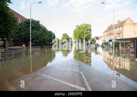 Part of Longbridge Road, East London, is seen flooded allegedly due to a burst water main. Stock Photo