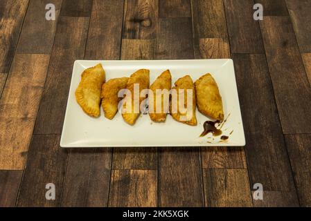 The empanadilla is a type of cake that can be considered a variant of the empanada. It is usually made with a dough filled with minced meat and other Stock Photo