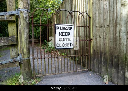 Please Keep Gates Closed Sign at iron gate in Ireland. Stock Photo