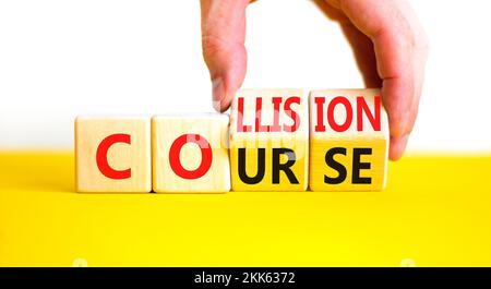 Collision course symbol. Concept word Collision course on wooden cubes. Beautiful yellow table white background. Businessman hand. Business collision Stock Photo