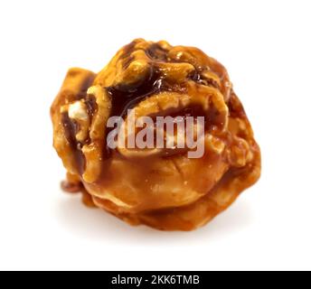 Caramel popcorn on a white background close-up. Popcorn Granule Isolate Stock Photo