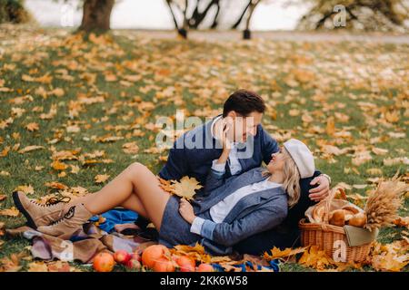 Happy couple enjoying golden autumn spring season in the park Stock ...