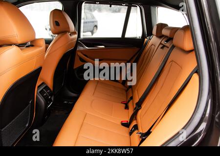 Modern SUV car inside. Leather light back passenger seats in modern luxury car. Comfortable leather seats. Stock Photo