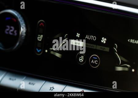 Digital control panel car air conditioner dashboard. Modern car interior conditioning buttons inside a car close up view. Stock Photo