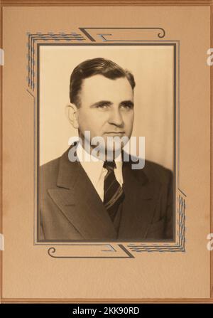 The photographer's father who died in 1983.    Vintage black and white 1940’s photo of a successful business man in period framing. Stock Photo