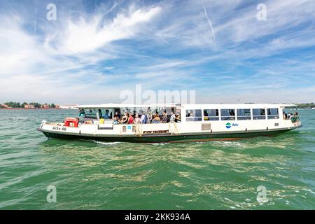 Venice, Italy - July 5, 2021:  the ferry on the way to Venice with view to St. Mark's square. Stock Photo