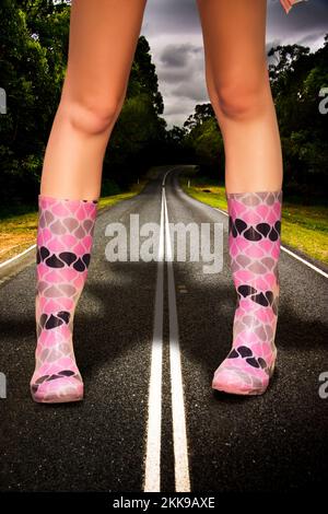 In A Storm Rain And Weather Concept A Giant Stands In Large Gum Boots On A Road Or Highway In A Colossal Overgrown And Gigantic Image Representing The Stock Photo