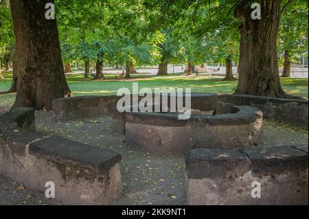 Cavalese in Fiemme Valley: 'Banco della Reson', a curious structure made of blocks of stone at the Pieve Park - 16th century. - Trento province,Italy Stock Photo