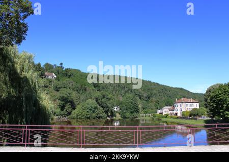 View of the River Tardes from the modern bridge at Chambon-sur-Voueize a pretty town located in the Creuse region of central France. Stock Photo