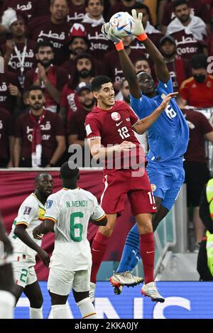 Karim Boudiaf of Qatar and Alfred Gomis of Senegal during Qatar v Senegal match of the Fifa World Cup Qatar 2022 at Thumama Stadium in Doha, Qatar on November 25, 2022. Photo by Laurent Zabulon/ABACAPRESS.COM Stock Photo