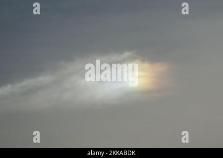 Cloud refracting in rainbow colors Stock Photo