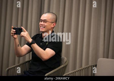 Zhao Changpeng, founder and chief executive officer of Binance uses his cell phone to take a picture during an event in Athens, Greece, November 25, 2022. REUTERS/Costas Baltas