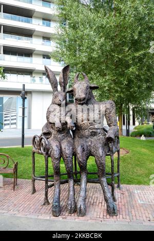 'The Minotaur and The Hare on Bench' sculpture by Sophie Ryder, Harbour Quay Gardens, Wood Wharf, Canary Wharf, London, UK Stock Photo