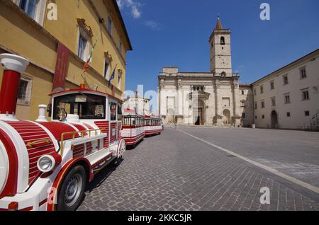 Ascoli Piceno - Marche - In the foreground the little train of the historic Piazza Arringo, in the background the Cathedral of Sant'Emidio Stock Photo