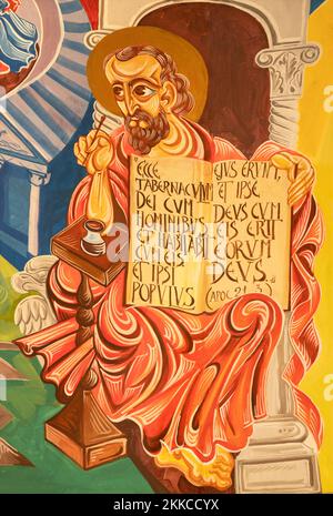 FORLÍ, ITALY - NOVEMBER 11, 2021:   The modern fresco of St. John the Evangelist in the church Chiesa di San Giovanni Battista di Coriano by Franco Vi Stock Photo